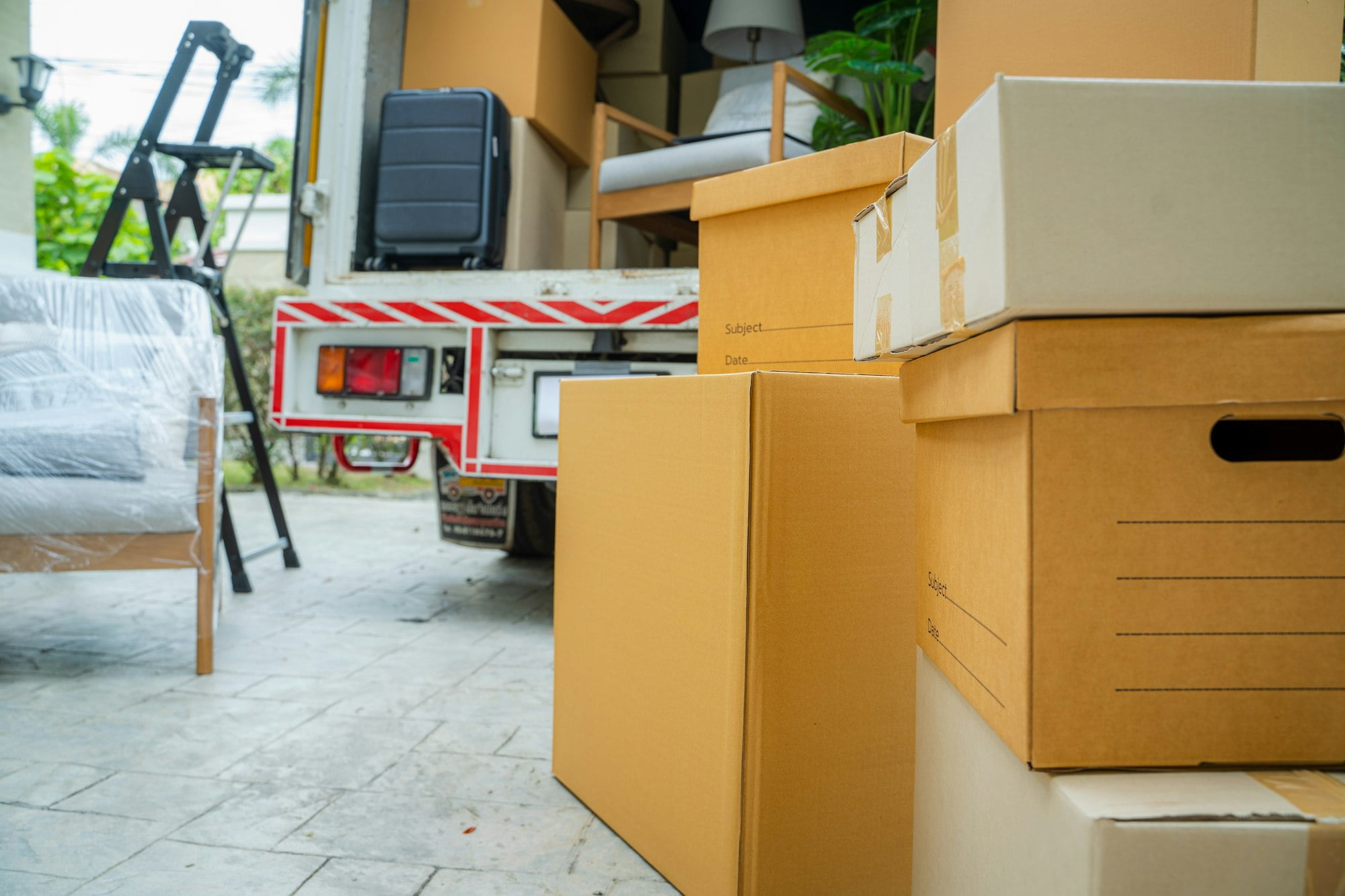 House moving service,Boxes waiting to be moved into a new home.